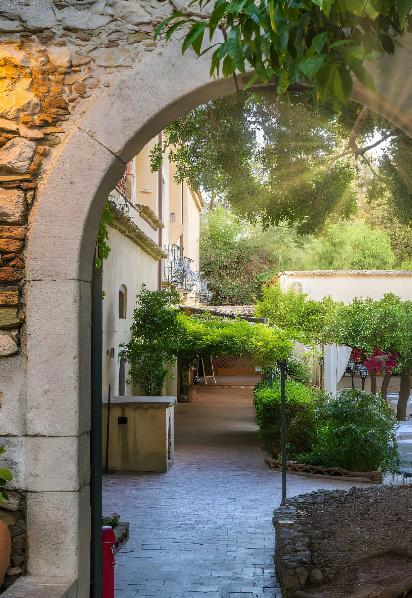 Colonial arch opening into a lush garden